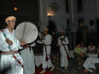 men holding instruments while dancing